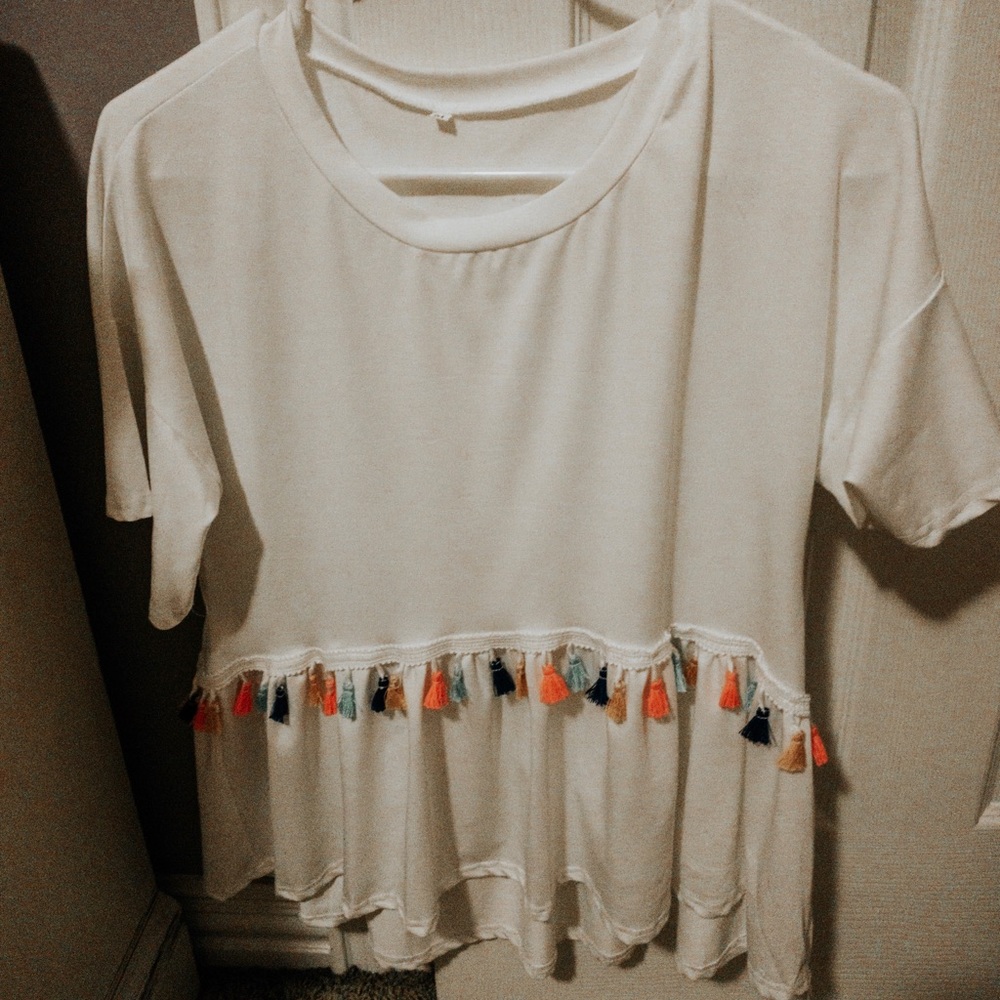 White shirt w/ colorful tassels!